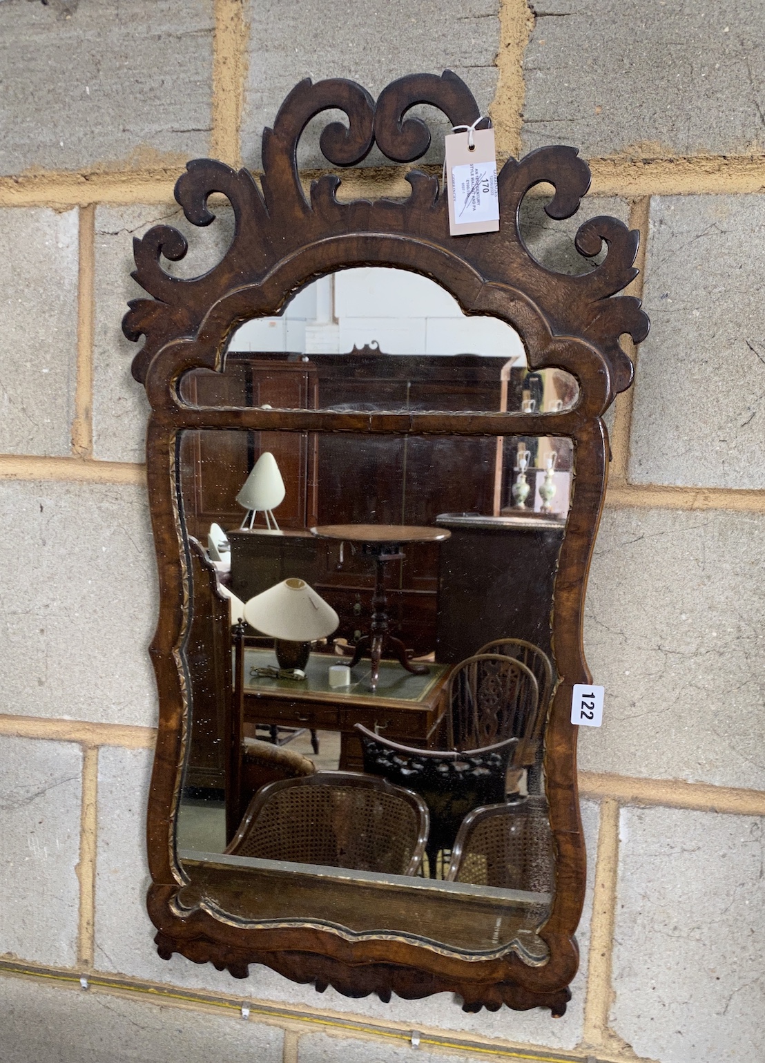 An 18th century style walnut and parcel gilt fret carved wall mirror, width 41cm, height 72cm, NB: From the Estate of Rt Hon Lord Lawson of Blaby